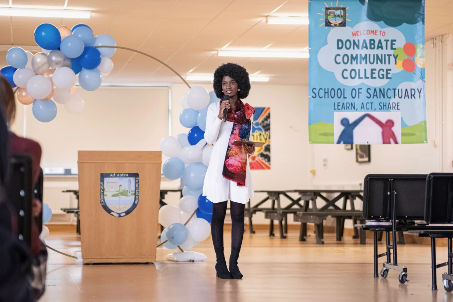 Elizabeth Zion presenting to students in a school hall