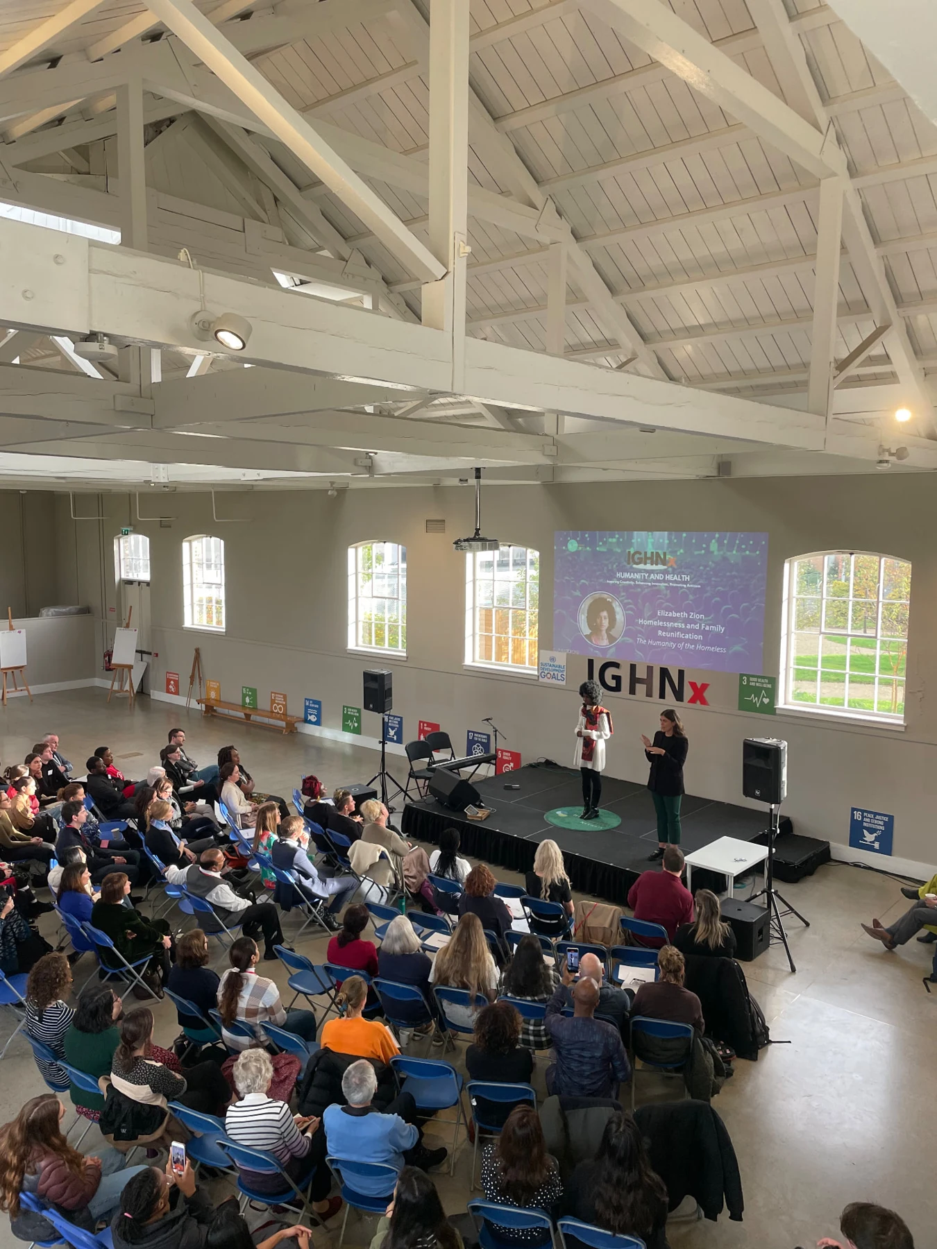Audience attending an event in a bright hall
